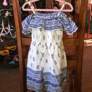 Girls off shoulder dress in white and blue design.